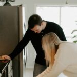 A parent and child in the kitchen during the morning family routine