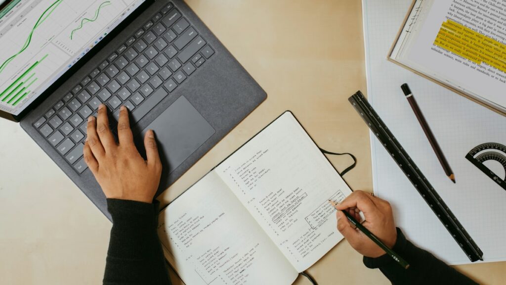 A person sitting at a desk learning something new on a laptop