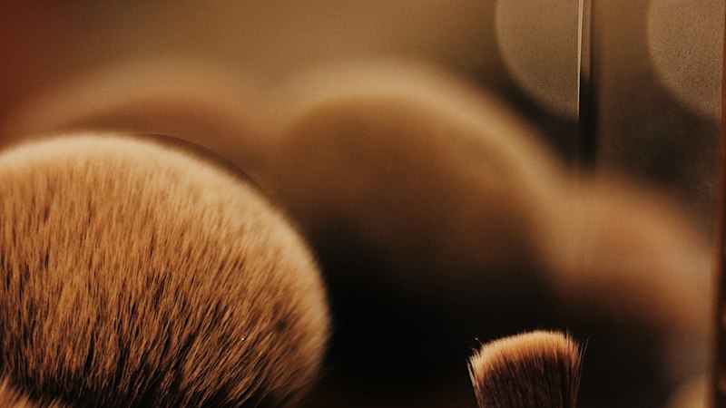 Brown makeup brushes in a holder