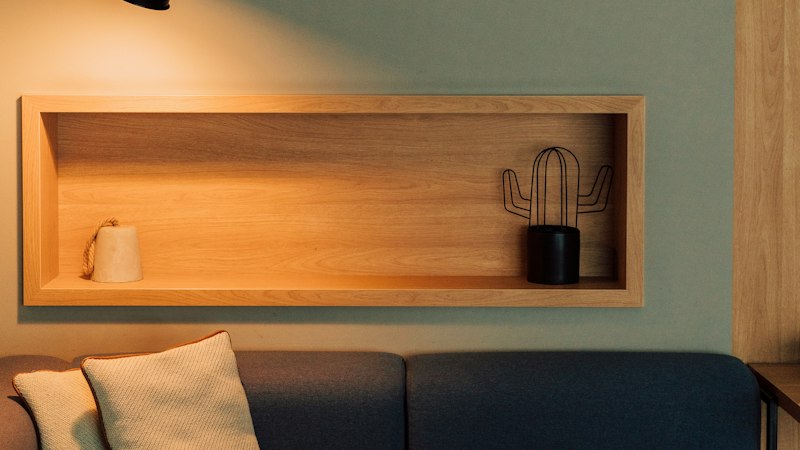 Living room with a couch and a warm lamp